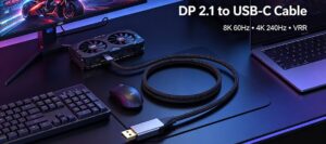Black braided DP 2.1 to USB-C cable connected to gaming PC and 8K high refresh monitor